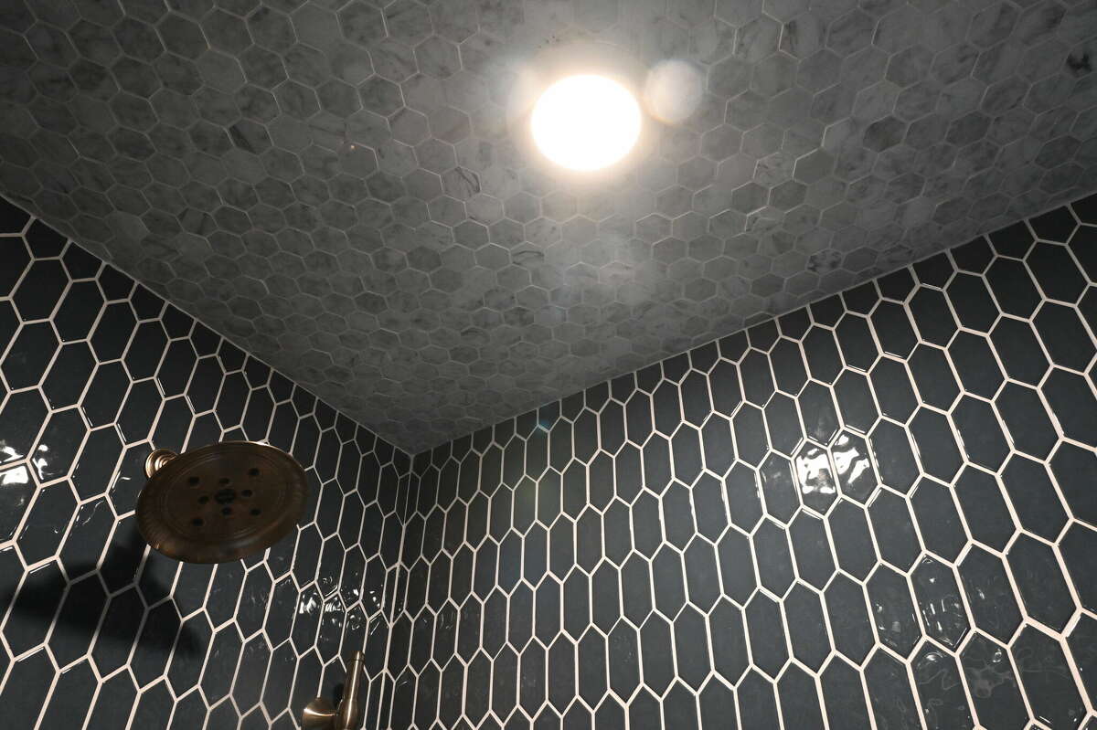 The owner's bathroom was done in a variety of different tile designs and colors. 