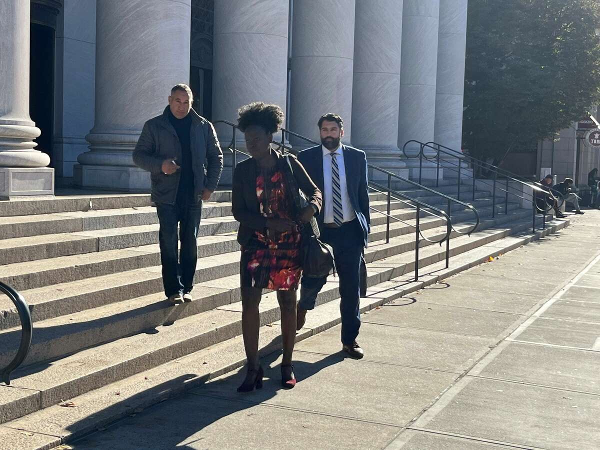 John Trasacco, left, leaves court in New Haven following a hearing on Nov. 2, 2022 with defense counsel Lillian Odongo and Andrew Giering.