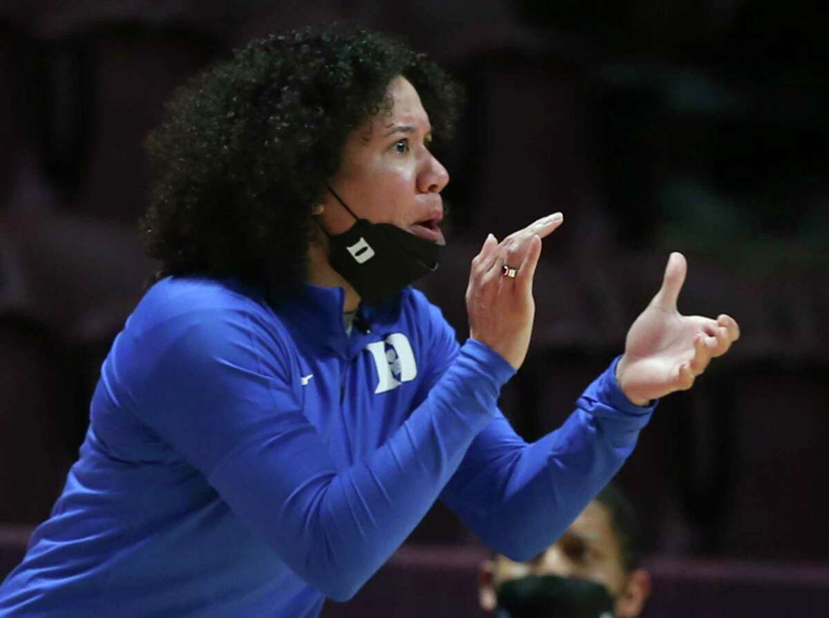 FILE - Duke head coach Kara Lawson gives instructions to her team during the first half of an NCAA college basketball game against Virginia Tech, Thursday, Dec. 30, 2021 in Blacksburg Va. The Atlantic Coast and Southeastern conferences have led the way among the power conferences in hiring coaches of color to lead women’s basketball programs. (Matt Gentry/The Roanoke Times via AP, File)