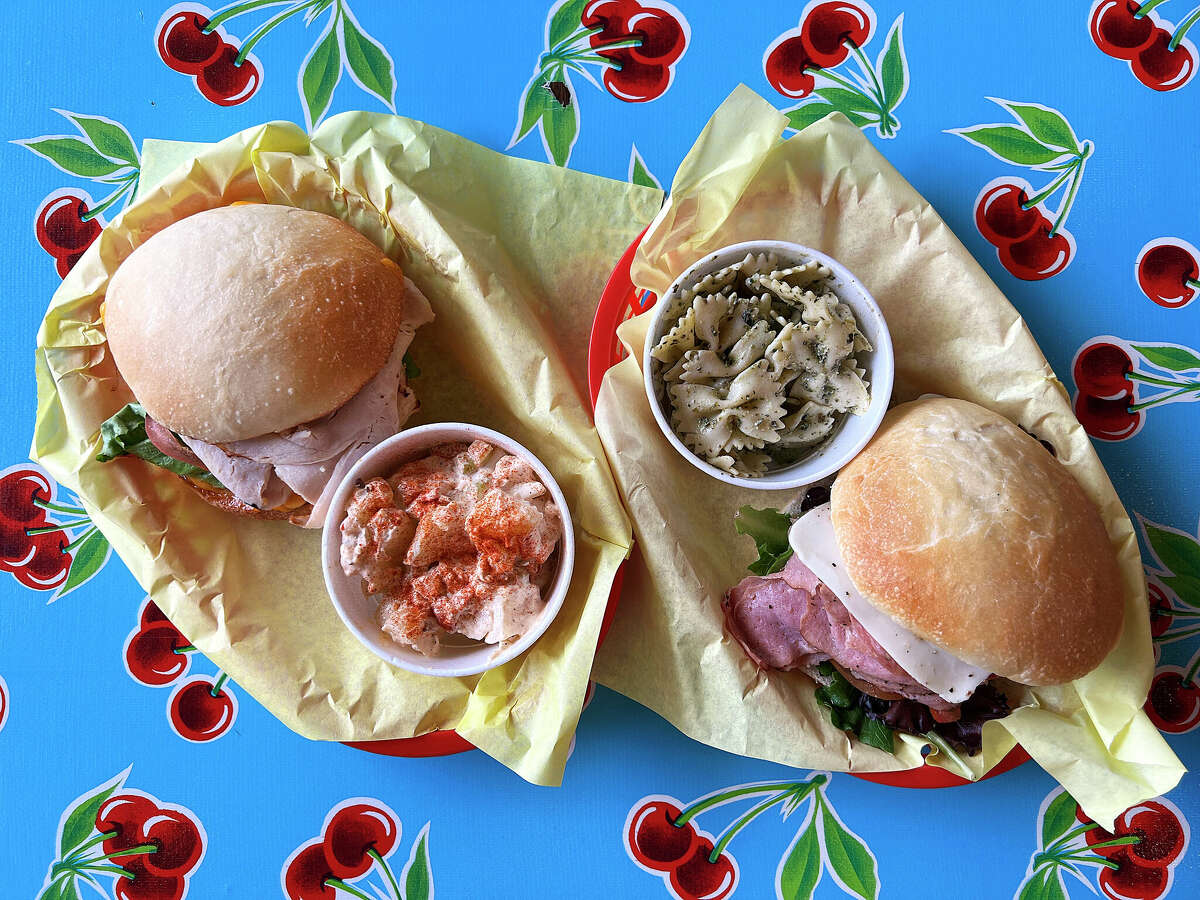 The sandwich menu includes the hot Turkey Chupacabra, left, and a cold Italian sandwich at The Station Cafe in the King William Historic District in San Antonio. Optional sides sold separately include potato salad and pasta salad. 