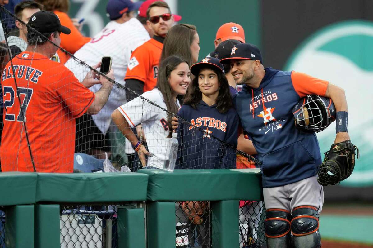Houston Astros bullpen catcher Javier Bracamonte takes a selfie with fans before Game 4 of the World Series at Citizens Bank Park on Wednesday, Nov. 2, 2022, in Philadelphia.