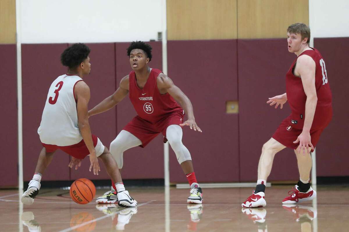 Stanford Men’s basketball’s Harrison Ingram (55) guards Jarvis Moss (3) as Michael Jones (13) watches during practice in Stanford, Calif., on Wednesday, November 2, 2022.