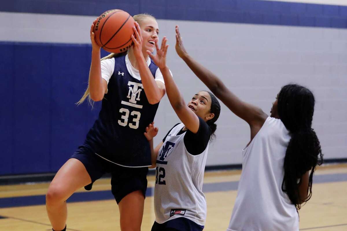 Katelyn Kabrich, left, during practice in the secondary gym at Tomball Memorial High School Wednesday, Nov. 2, 2022 in Tomball, TX.