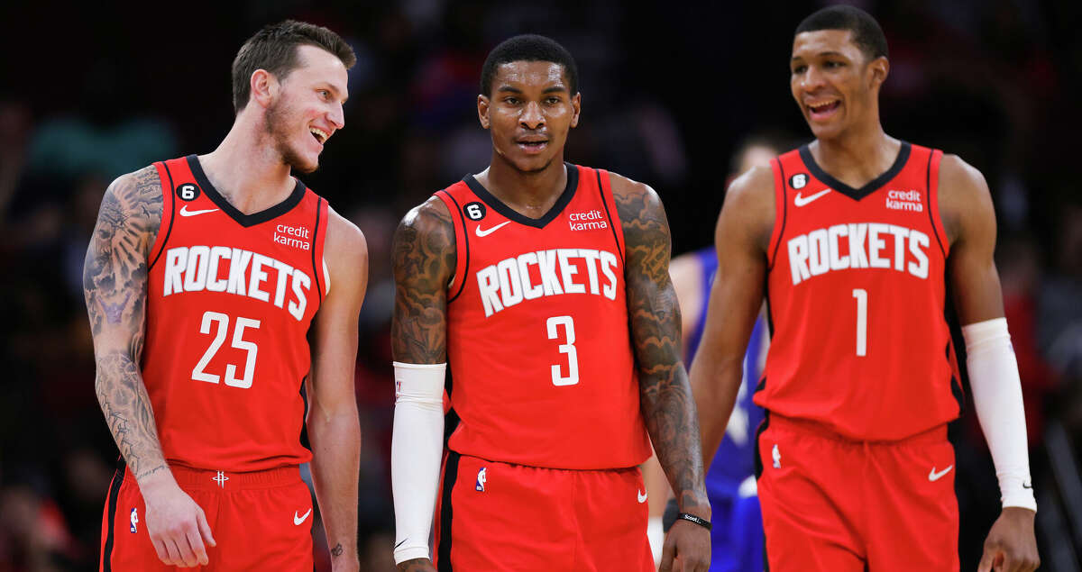 Garrison Mathews #25, Kevin Porter Jr. #3, and Jabari Smith Jr. #1 of the Houston Rockets walk to the bench during the first half against the LA Clippers at Toyota Center on November 02, 2022 in Houston, Texas. (Photo by Carmen Mandato/Getty Images)