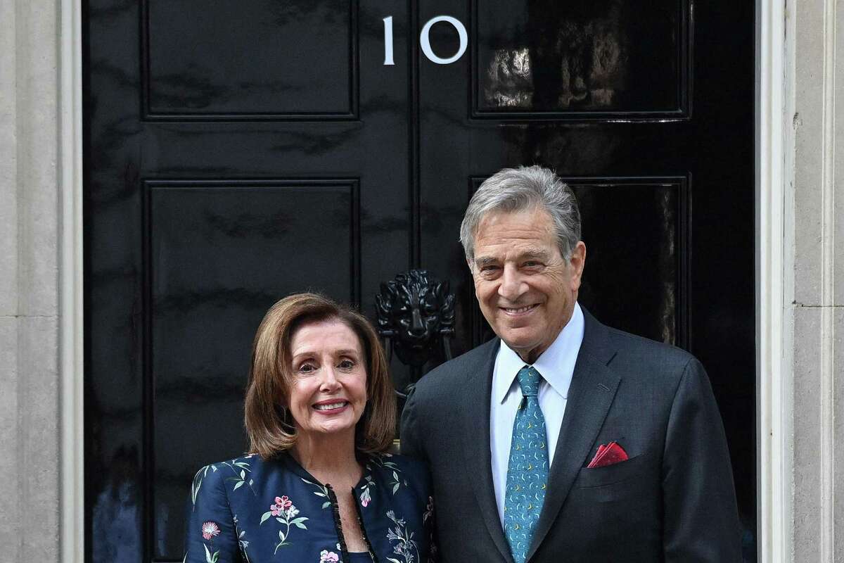 U.S. Speaker of the House Nancy Pelosi, left, and her husband Paul Pelosi, pose for the media outside of 10 Downing St. in central London, on Sept. 16, 2021. Paul Pelosi faces a long recovery after an intruder attacked him with a hammer on Oct. 28 in their San Francisco home. (Justin Tallis/AFP/Getty Images/TNS)
