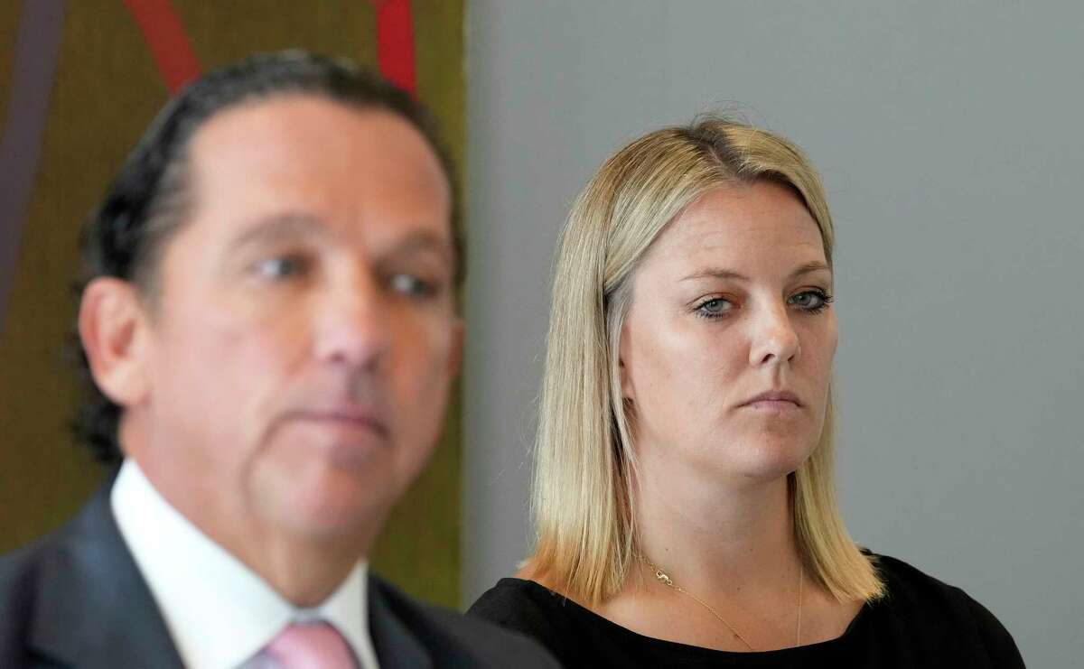 Attorney Tony Buzbee and his client former San Antonio Spurs consulting psychologist Dr. Hillary Cauthen, right, are shown during a press conference Thursday, Nov. 3, 2022, in Houston. Cauthen has accused former Spurs NBA player Josh Primo of exposing himself to her.