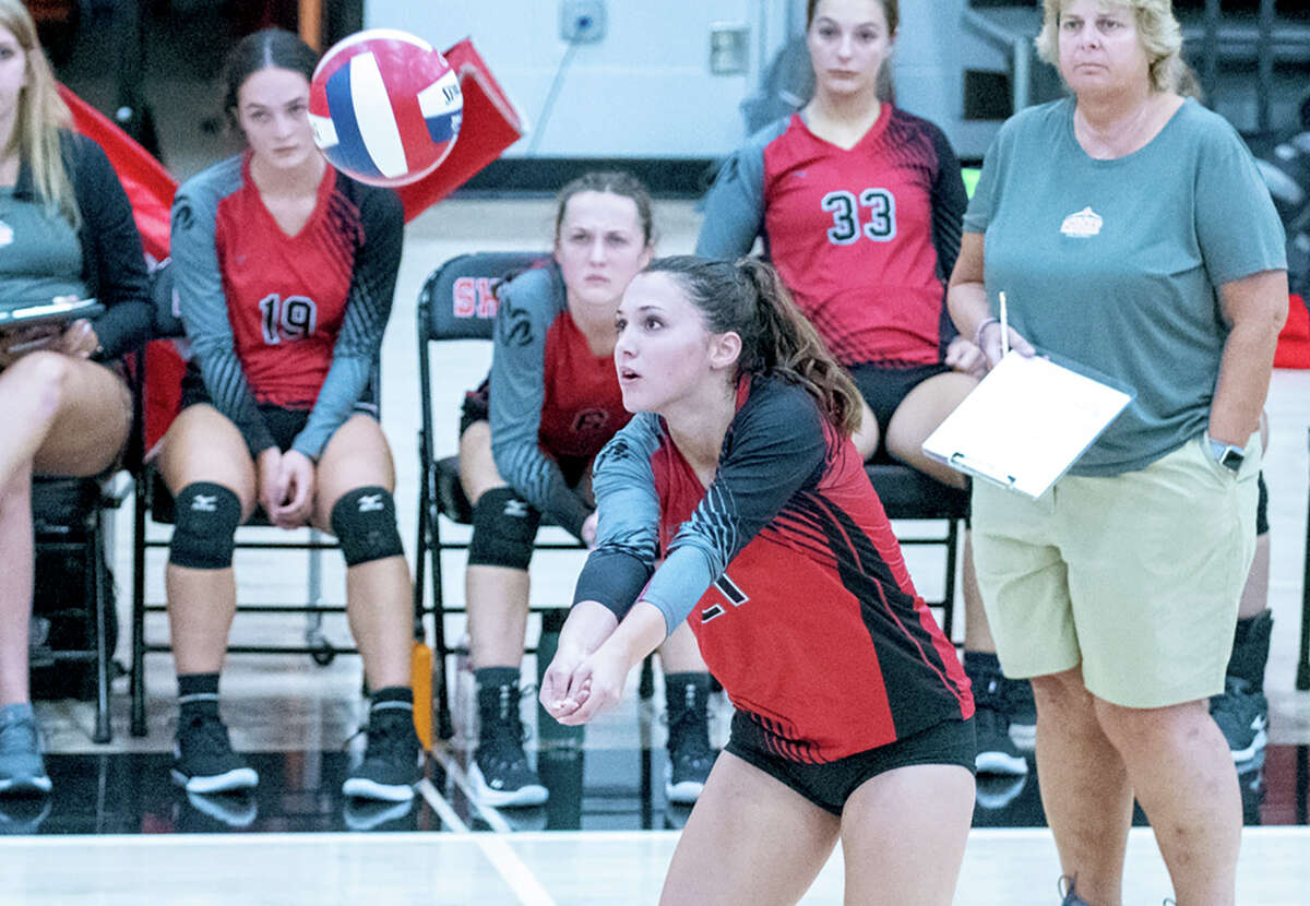 Cheshire's Avery Mola keeps the ball up during a volleyball match in 2022.