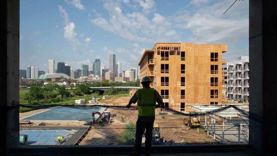 Tyler West, a core driller, looks out as construction continues on the East River mixed-use development Thursday, Sept. 8, 2022, in Houston.