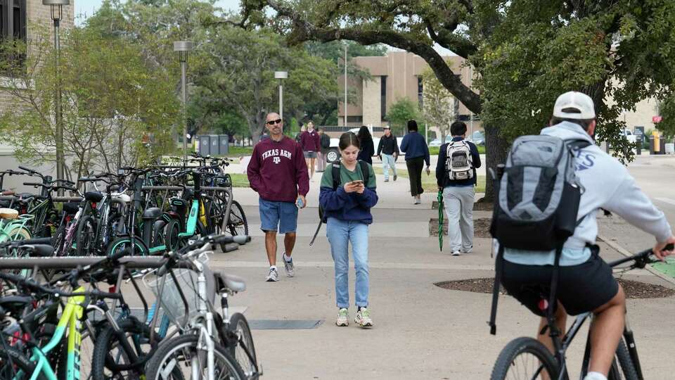 People are shown on the campus of Texas A&M University Tuesday, Nov. 1, 2022, in College Station.