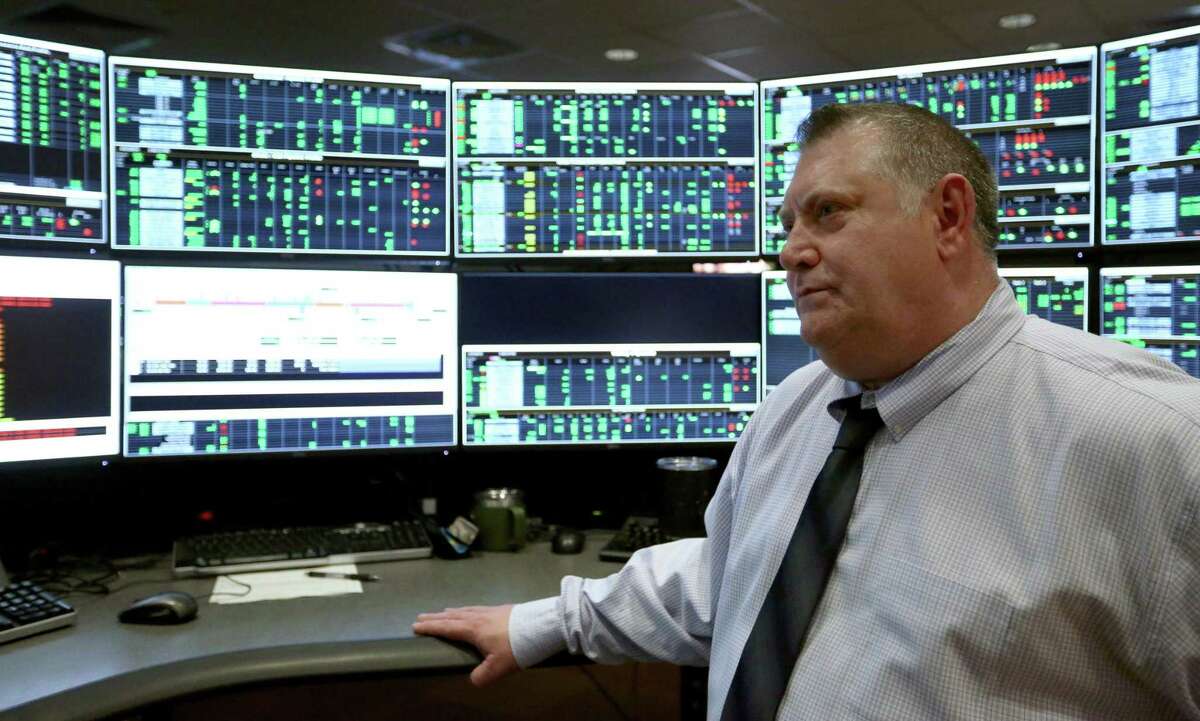 Control center senior manager Mark Carter statnds Tuesday, April 23, 2019, in front of a work station in NuStar Energy L.P.'s pipeline control room. From the central location in NuStar's San Antonio headquarters, employees can monitor and control virtually every aspect of the company's pipelines including opening and closing valves and watching for any pipeline problems.