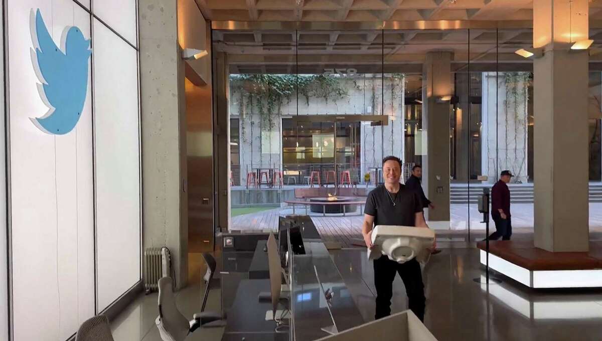 This video grab taken from a recent video posted on the Twitter account of billionaire Tesla chief Elon Musk, shows himself carrying a sink as he enters the Twitter headquarters in San Francisco. Musk will reportedly end the company’s work from anywhere policy.