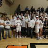 The Bad Axe student section cheers on their Lady Hatchets.