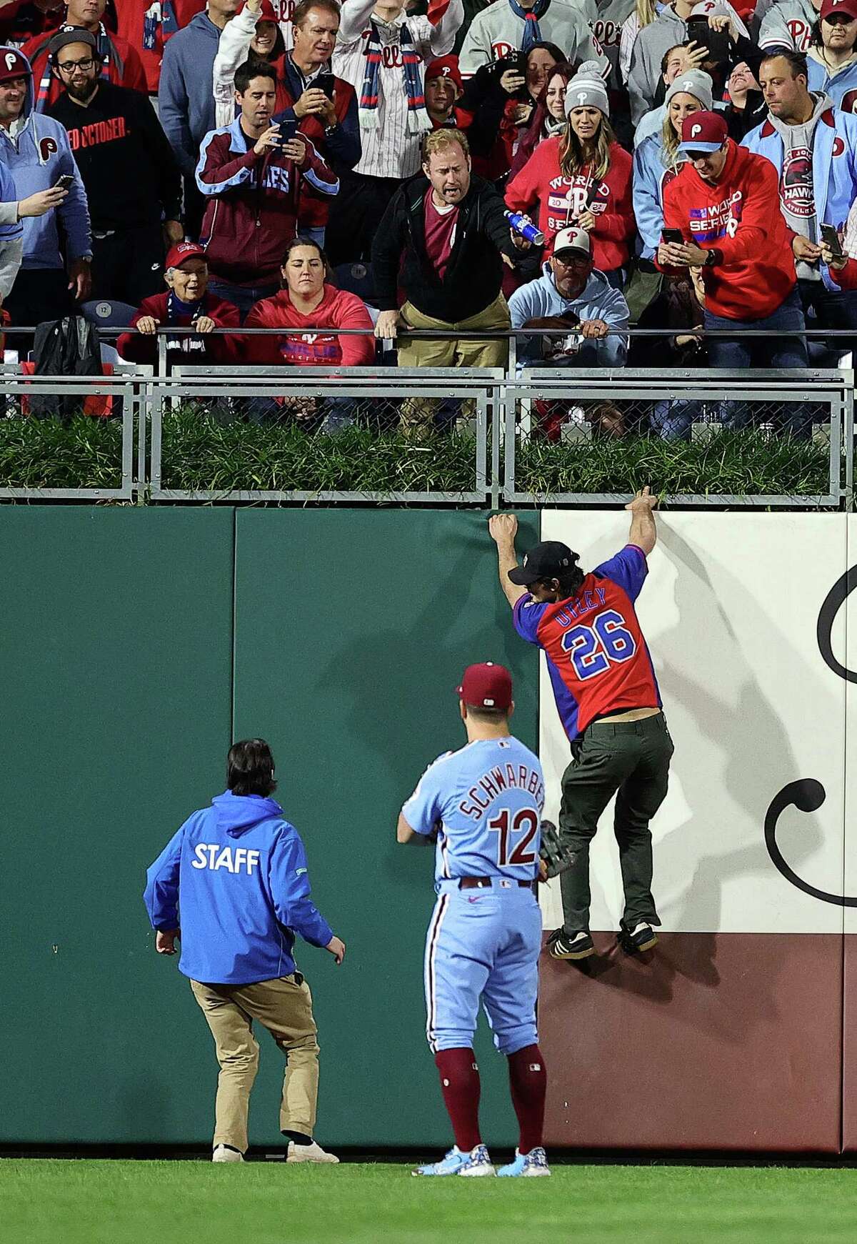 Astros fans greet Phillies fan decked out for World Series Game 1