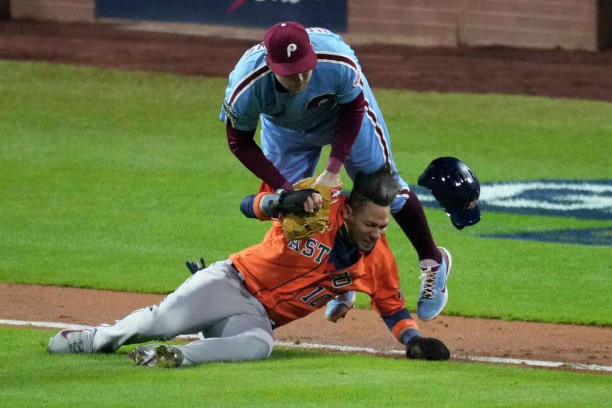 Philadelphia Phillies Rhys Hoskins (17) collides with Houston Astros Yuli Gurriel (10) after tagging him out in a rundown to end the top of the seventh inning during Game 5 of the World Series at Citizens Bank Park on Thursday, Nov. 3, 2022, in Philadelphia.