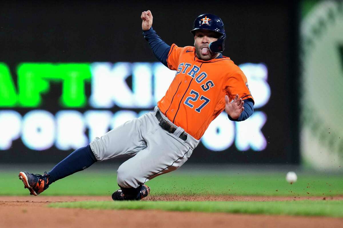 Houston Astros Jose Altuve (27) slides into second on Jeremy Peña’s single that allowed him to advance to third in the eighth inning during Game 5 of the World Series at Citizens Bank Park on Thursday, Nov. 3, 2022, in Philadelphia.
