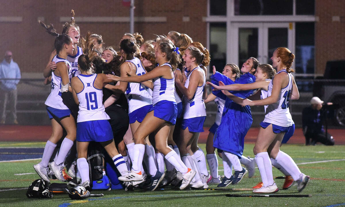 Darien celebrates after defeating Staples for the FCIAC field hockey championship at Brien McMahon on Thursday, Nov. 3, 2022.