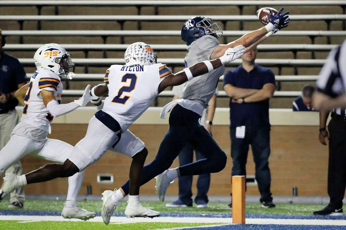 Rice wide receiver Bradley Rozner, right, pulls in a touchdown reception in the end zone in front of UTEP cornerback Ilijah Johnson, left, and safety Kobe Hylton (2) during the second half of an NCAA college football game Thursday, Nov. 3, 2022, in Houston. (AP Photo/Michael Wyke)