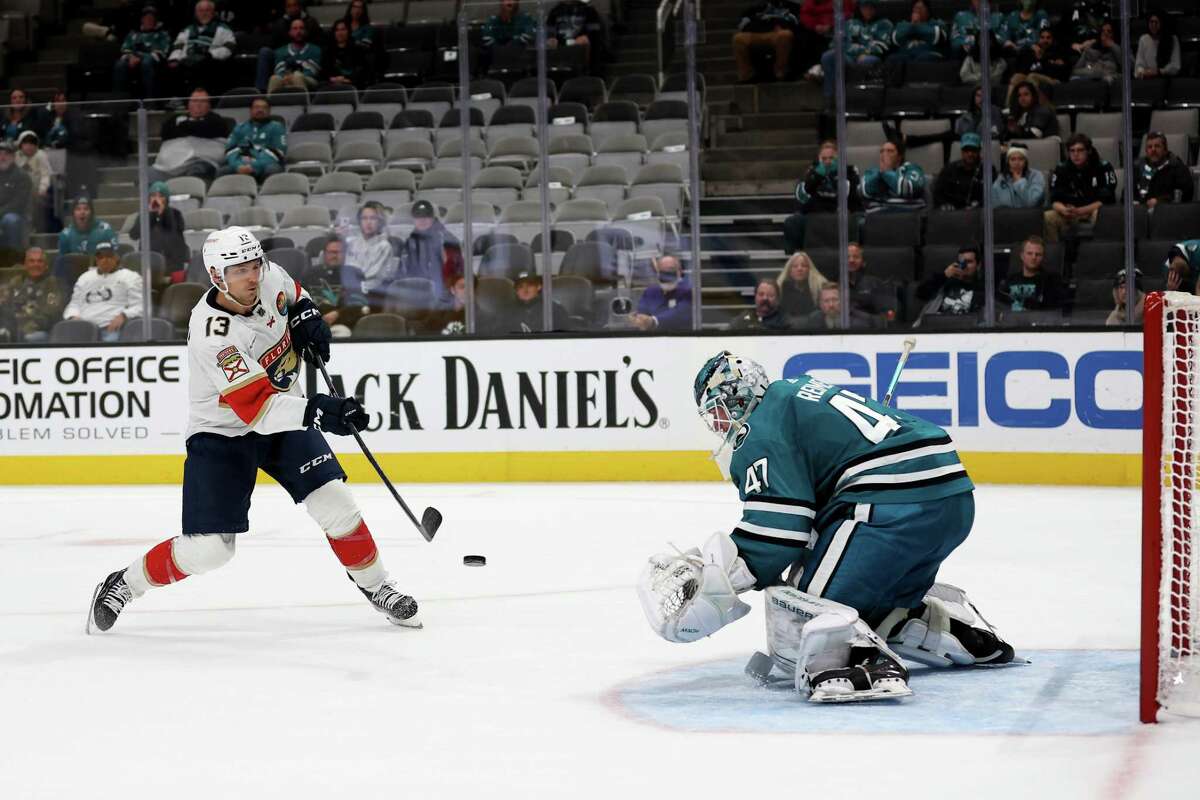Sam Reinhart of the Florida Panthers scores the winning goal past James Reimer of the San Jose Sharks in a shootout at SAP Center on Thursday.