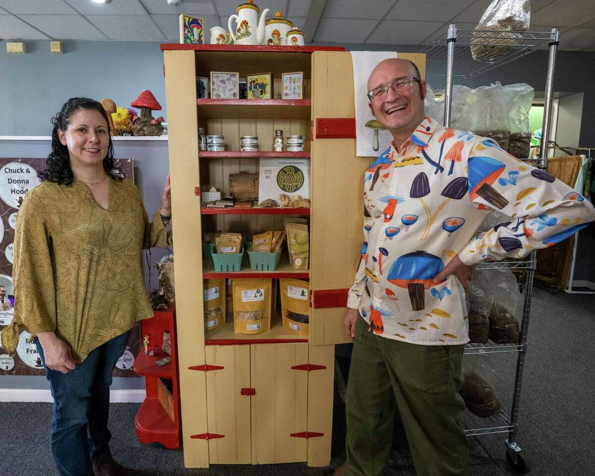 Amy Hood and Avery Stemple, co-owners of Collar City Mushrooms in Troy, NY, stand next to a display of dried mushrooms on Thursday, Oct. 27, 2022. (Jim Franco/Special to the Times Union)
