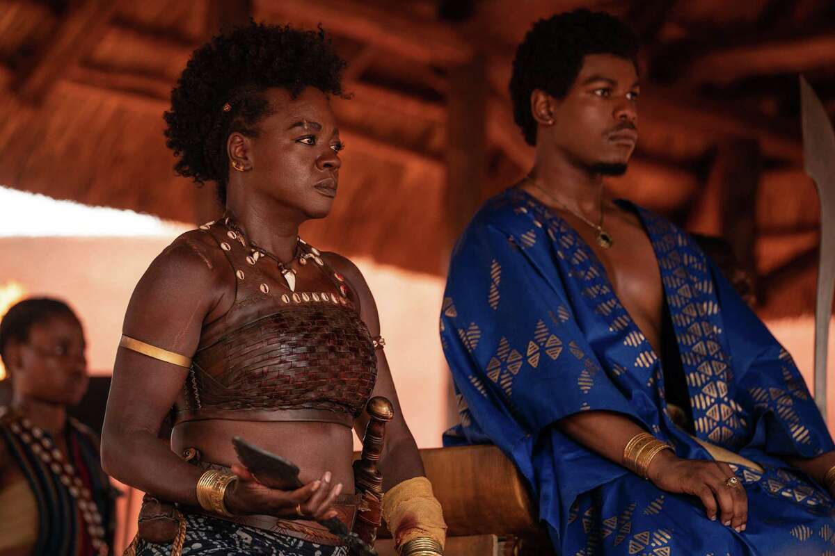 Viola Davis, left, and John Boyega in “The Woman King.” The film tells the story of the Agojie, an all-female unit of warriors, known for their courage who protected the West African kingdom of Dahomey during the 1800s. It made me want to return home.