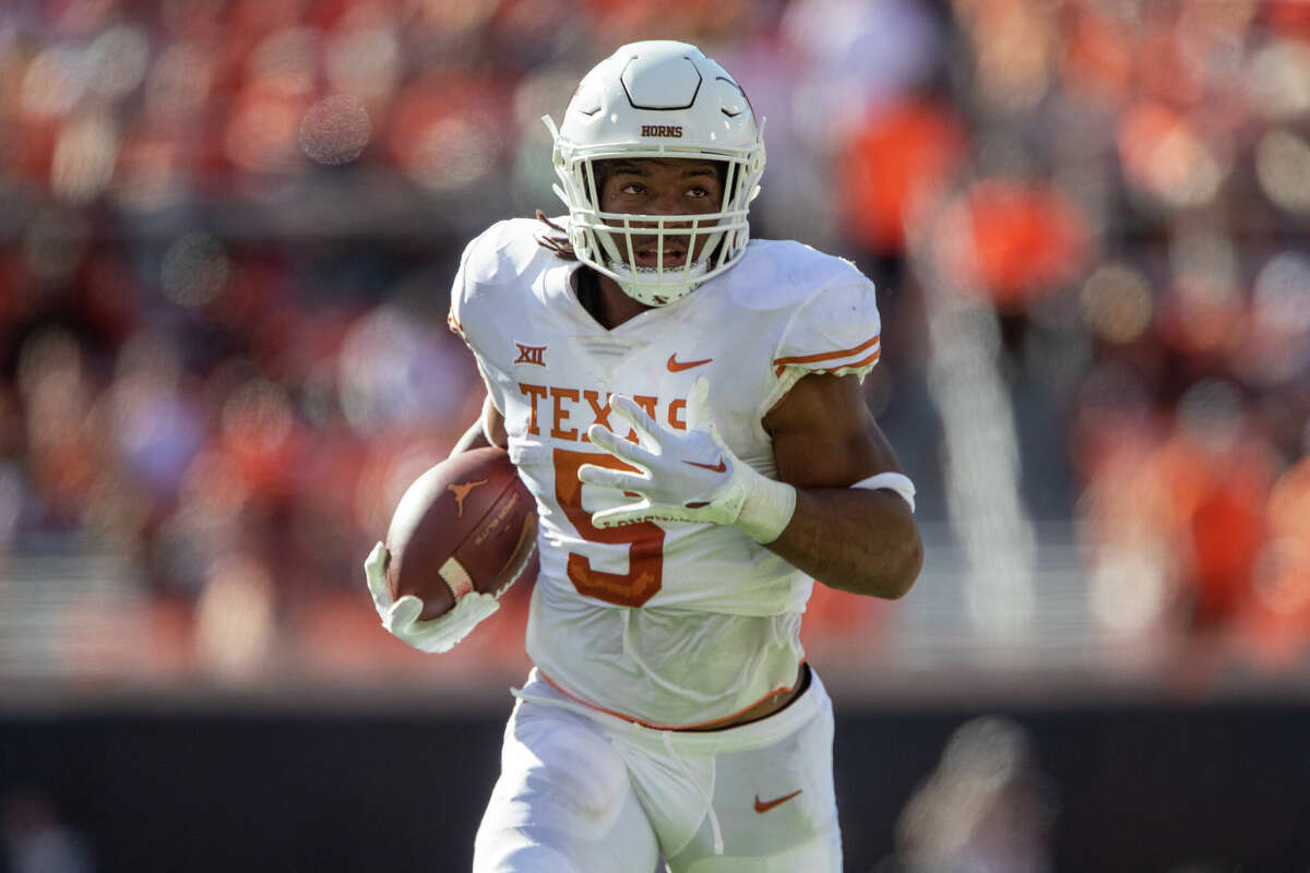 Texas Longhorns running back Bijan Robinson (5) heads to the end zone for a touchdown during the first half against the Oklahoma State Cowboys on October 22nd, 2022 at Boone Pickens Stadium in Stillwater, Oklahoma. (Photo by William Purnell/Icon Sportswire via Getty Images)