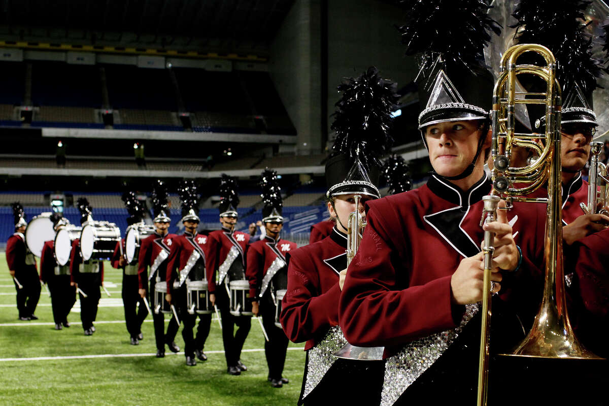 Members of the John Marshall High School band leave the field after competing in the Bands of America Super Regional Championships in 2009. The Super Regional Championships returned to the Alamodome on Friday, Nov. 4.