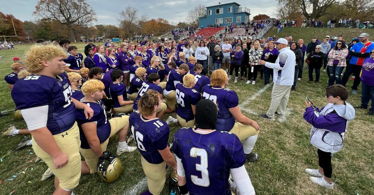 Routt coach Barry Creviston addresses the postgame huddle after Saturday's playoff win over Villa Grove at the old MacMurray College football field in Jacksonville.
