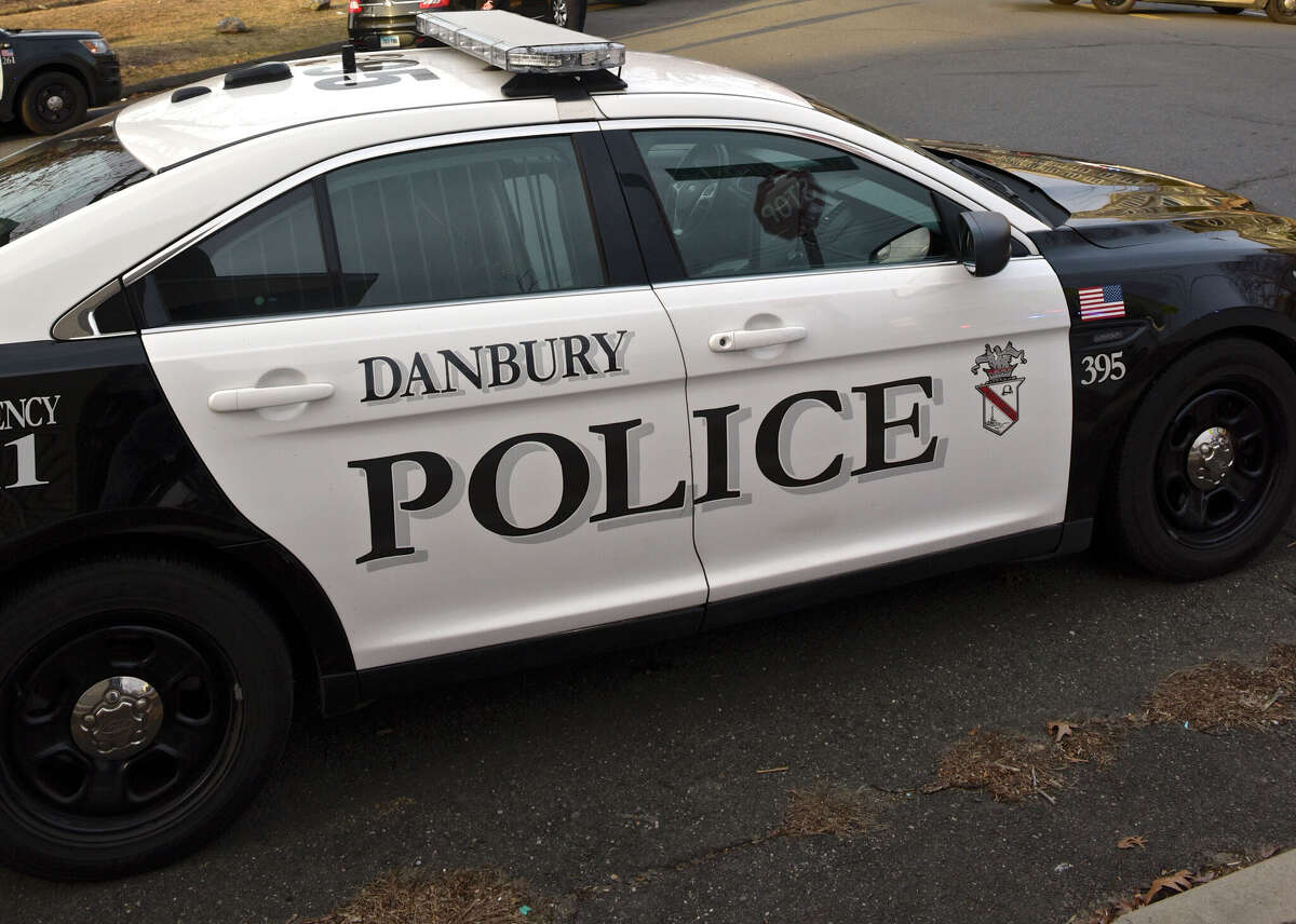A Danbury man is facing seven felonies and two misdemeanors after police say he and an unidentified individual robbed someone at gunpoint early Monday morning.