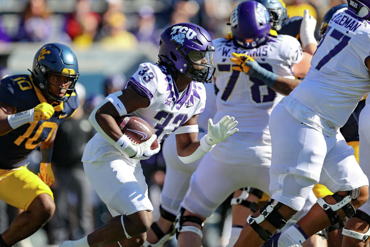 MORGANTOWN, WV - OCTOBER 29: TCU Horned Frogs running back Kendre Miller (33) carries the football during the first quarter of the college football game between the TCU Horned Frogs and the West Virginia Mountaineers on October 29, 2022, at Mountaineer Field at Milan Puskar Stadium in Morgantown, WV. (Photo by Frank Jansky/Icon Sportswire via Getty Images)