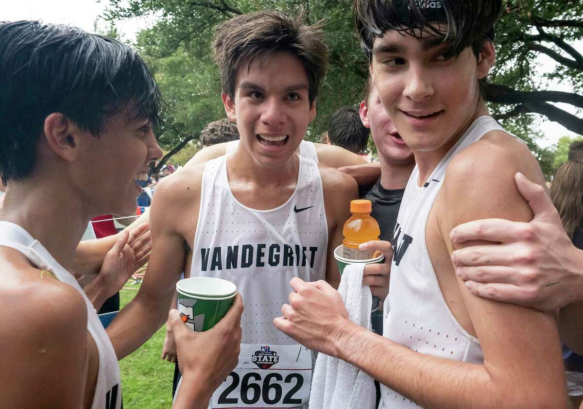 Austin Vandegrift Kevin Sanchez, (2662), center, is congratulated by teammates, Kai McCullough, (2660), left, and Eli Waddle, (2658), right, after the team found out the won second place in the UIL Boys 6A Cross Country Championship, Friday, Nov. 4, 2022, in Round Rock, Texas. Kevin Sanchez, (2662), won first place in the individuals.