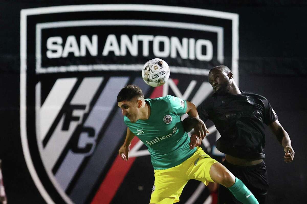 San Antonio FC’s Samuel Adeniran (14) takes a header against Oakland Roots’ Daniel Barbir (14) during their soccer game in the first round of the playoffs at Toyota Field on Friday, Oct. 28, 2022. San Antonio defeated Oakland, 3-0.