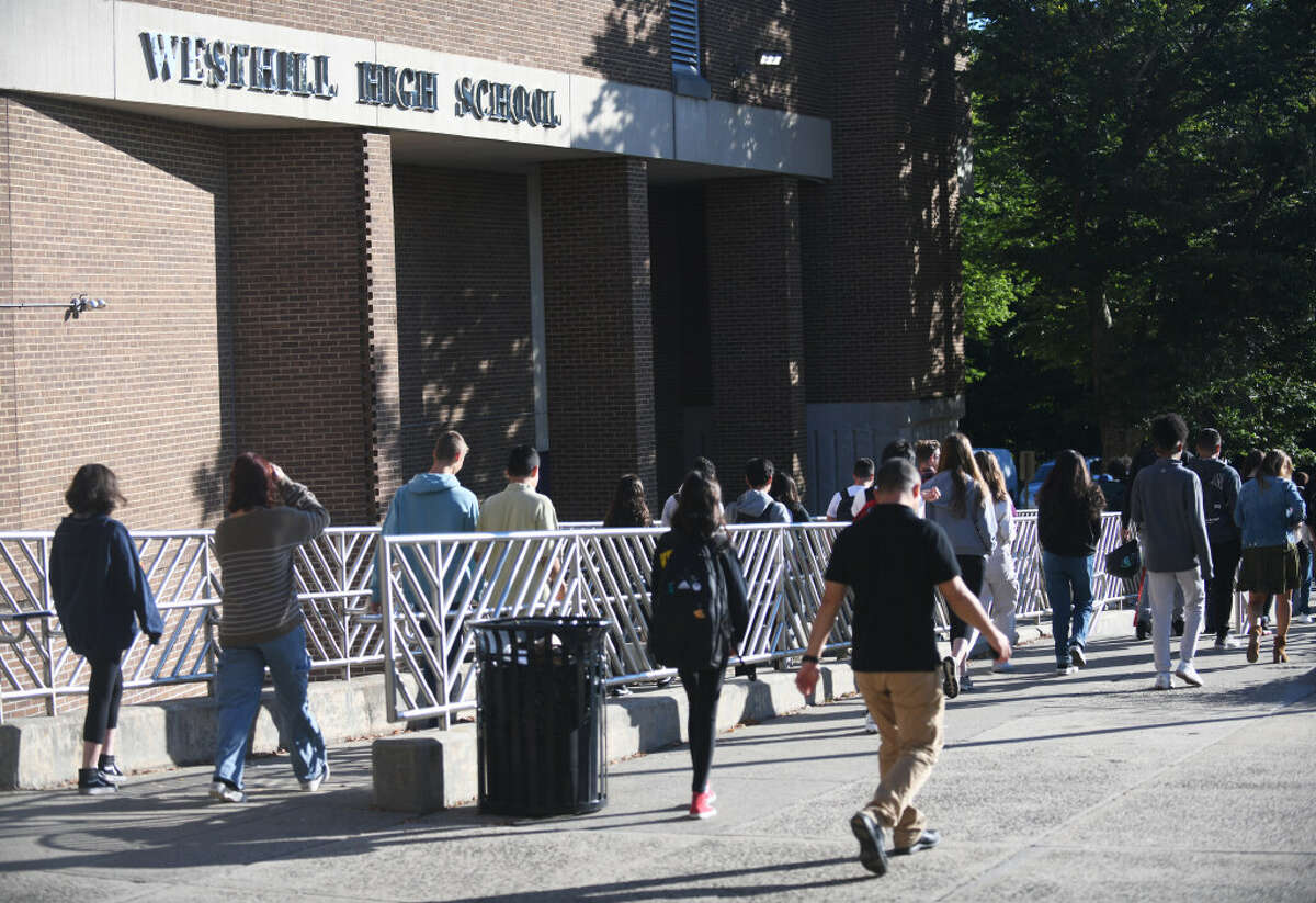 Students are dismissed from Westhill High School in Stamford, Conn. Thursday, Sept. 29, 2022.