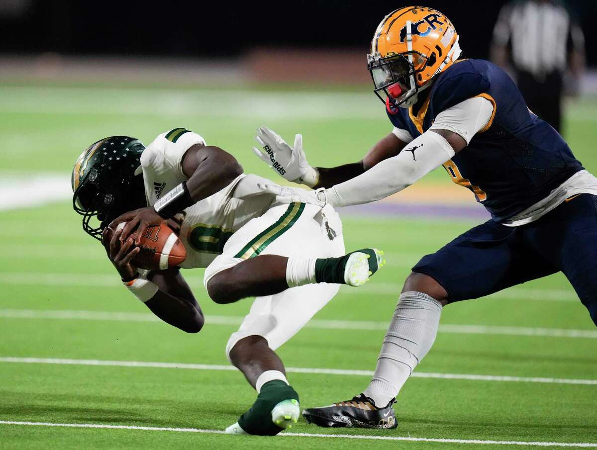 Cy-Falls quarterback Jakob Leavatts, left, is sacked by Cy-Ranch defensive lineman Ashton Porter during a game in November 2022. 
