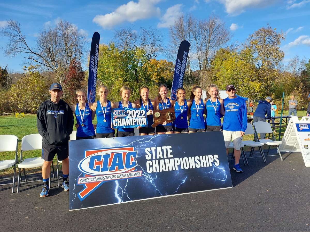Glastonbury celebrates winning team title with 65 points at CIAC State Open Girls Cross Country championship at Wickham Park on Friday, Nov. 4, 2022.