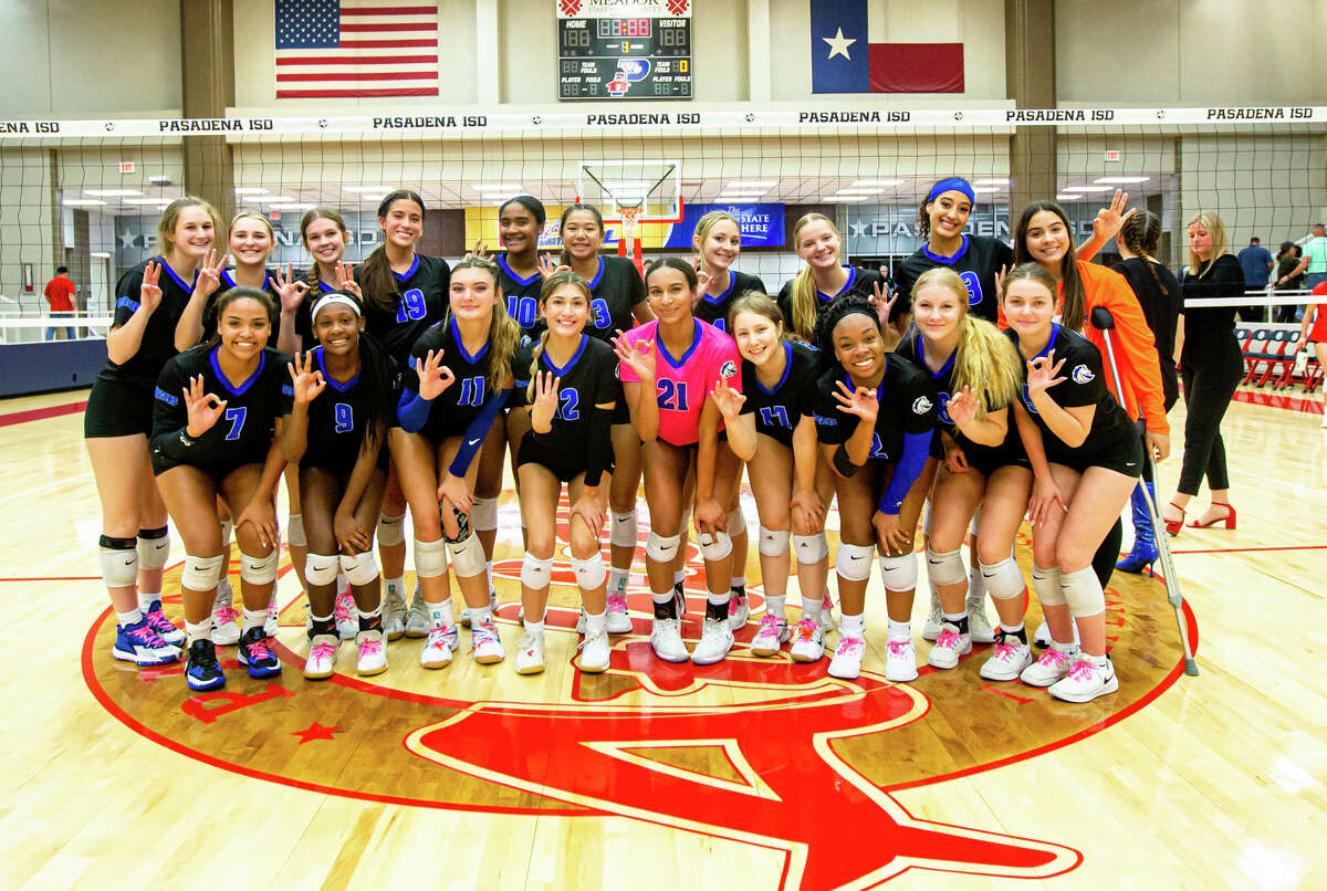 Clear Springs players pose for a group photo after a high school volleyball game, Region III-6A area playoffs, Atascocita vs. Clear Springs at Phillips Gym in Pasadena, TX, Friday, November 4, 2022. Clear Springs defeated Atascocita 3-0.