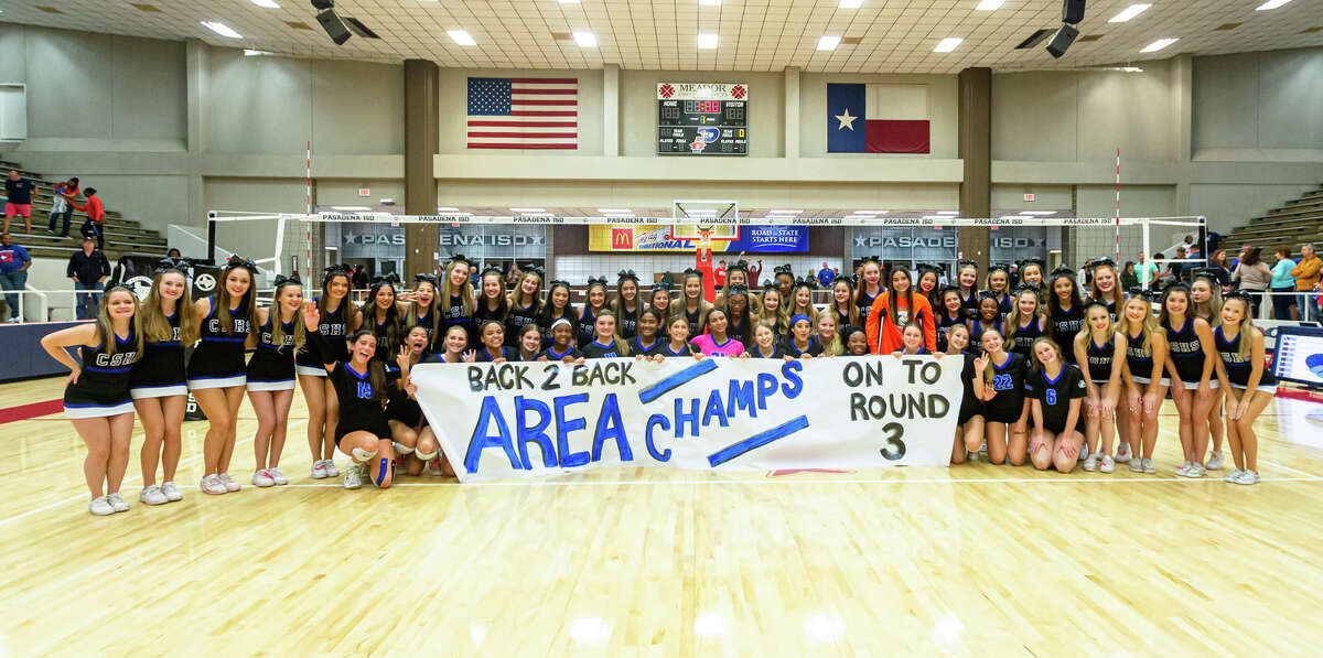 Clear Springs players and cheerleaders pose for a group photo after a high school volleyball game, Region III-6A area playoffs, Atascocita vs. Clear Springs at Phillips Gym in Pasadena, TX, Friday, November 4, 2022. Clear Springs defeated Atascocita 3-0.