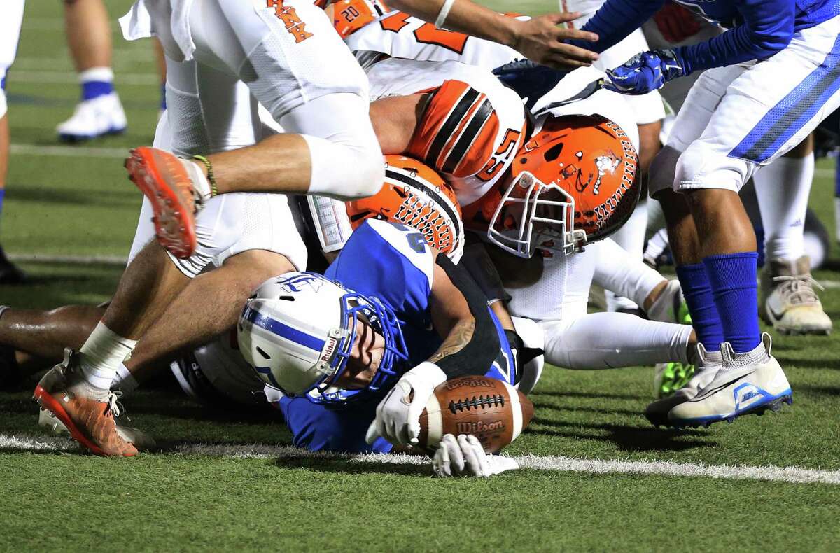 Lanier’s Mario Torres (37) extends himself to get the touchdown in the first half to help the Voks lead 21-14 in the first half against Burbank during their game at Alamo Stadium on Friday, Nov. 4, 2022.