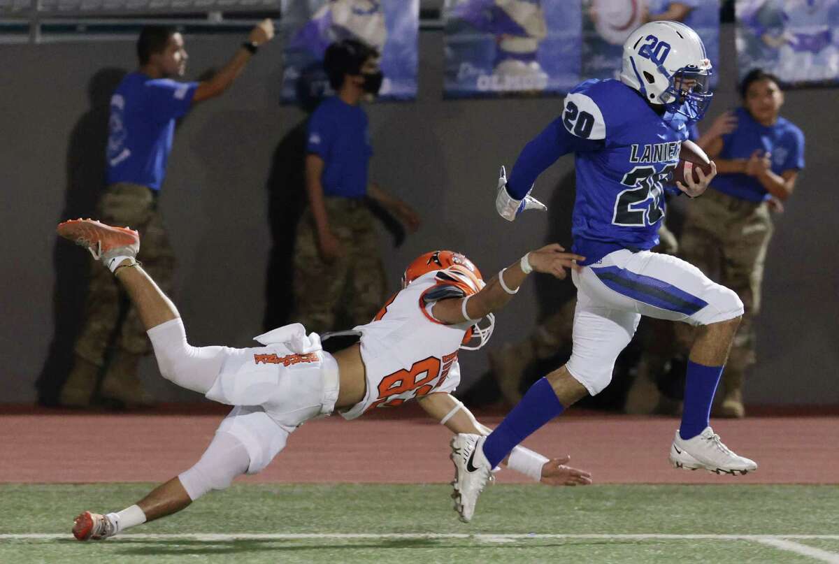 Lanier’s Jeremiah Huizar (20) breaks off a final Burbank tackler Karlos Aguirre (83) to score a 60-yard touchdown on the team’s first possession of the game at Alamo Stadium on Friday, Nov. 4, 2022.