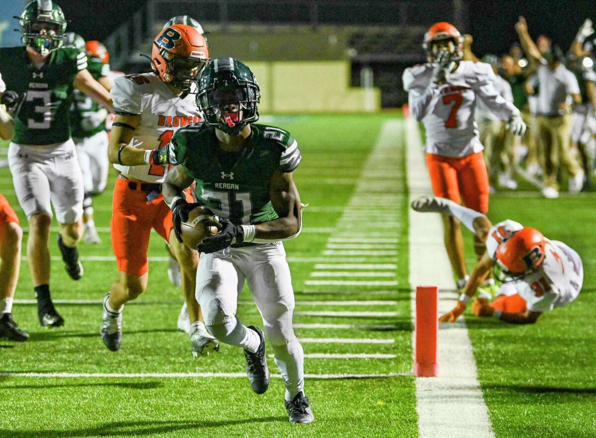 Cole Pryor (21) of Reagan, scores in the third quarter during high school football action against Brandeis at Comalander Stadium on Friday, Nov. 4, 2022. The District 28-6A championship was at stake.