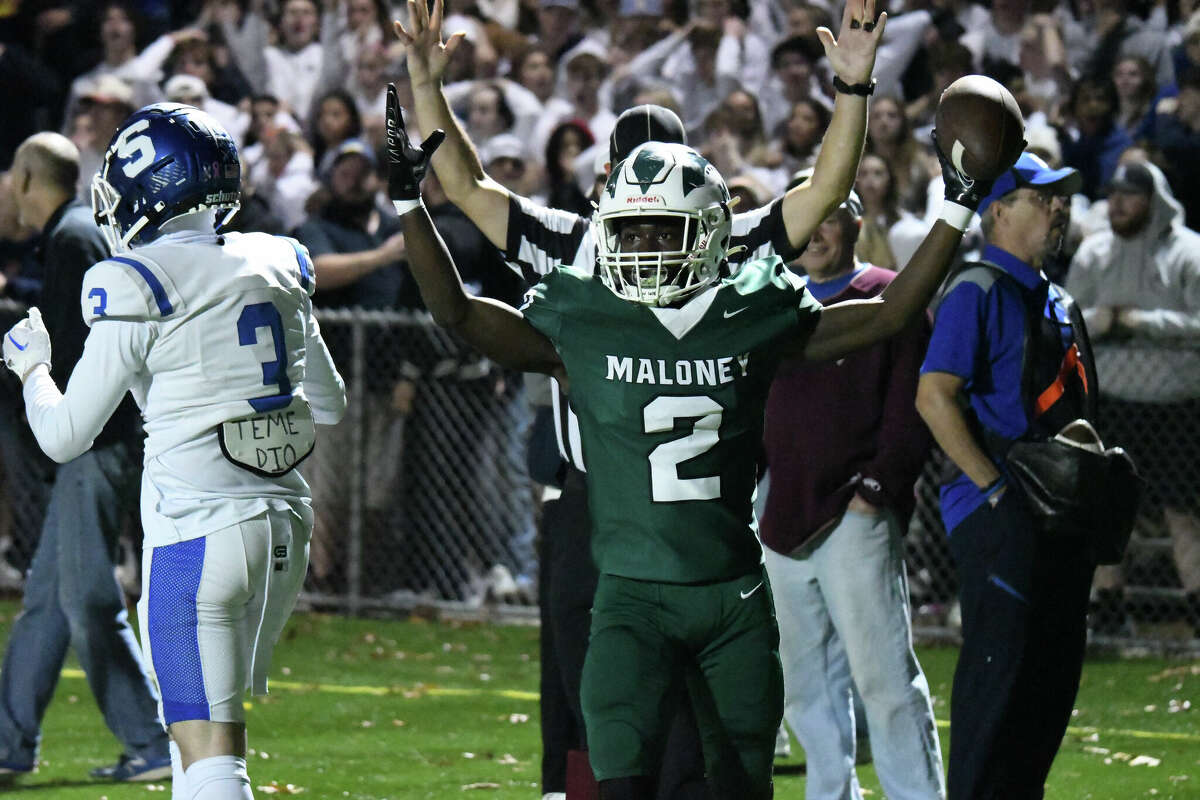 Maloney's Donte Kelly celebrates after catching a two-point conversion during a football game between Maloney and Southington at Falcon Field, Meriden on Friday, Nov. 4, 2022.