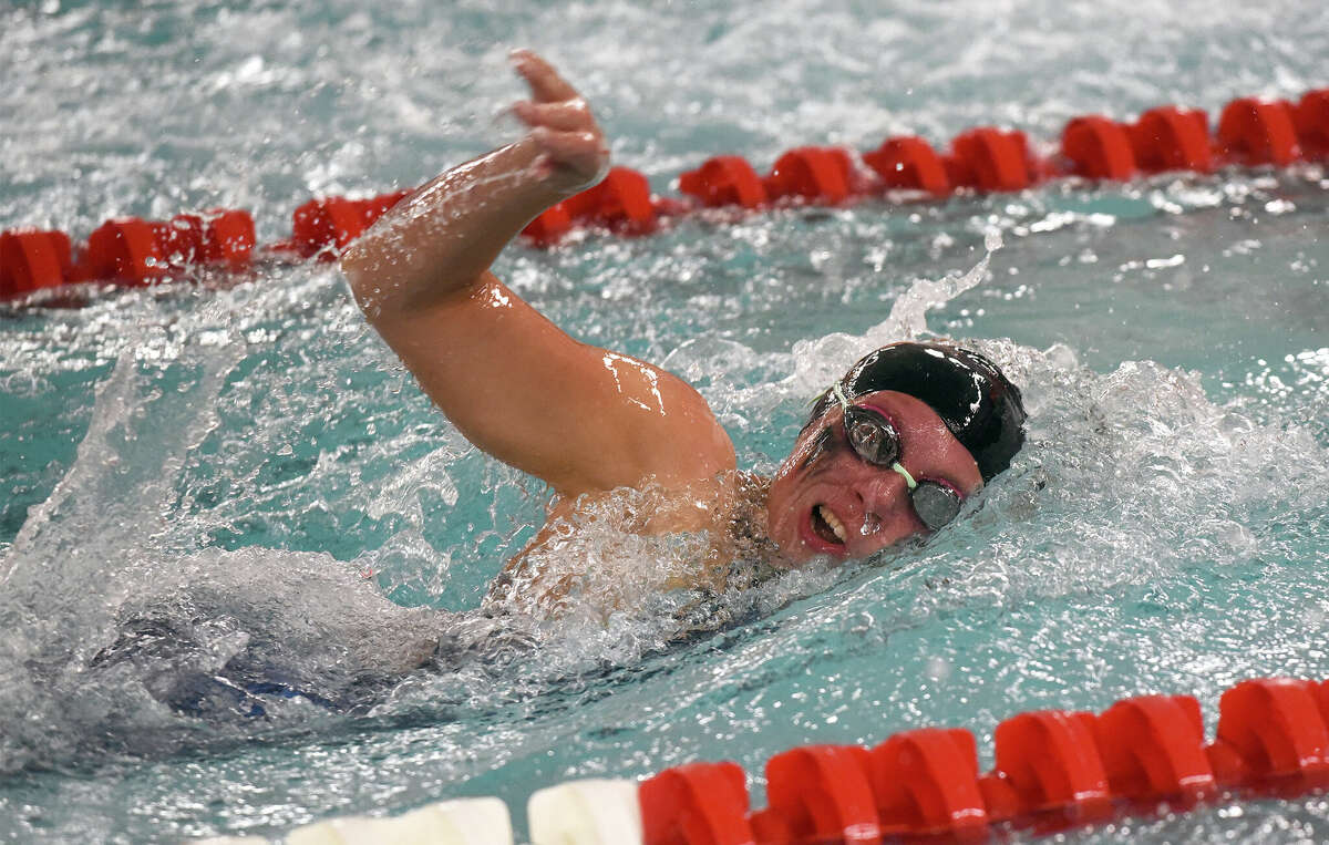 Ridgefield's Ava Ward competes in the 200-yard freestyle during the FCIAC girls swimming finals in Greenwich on Friday, Nov. 4, 2022.