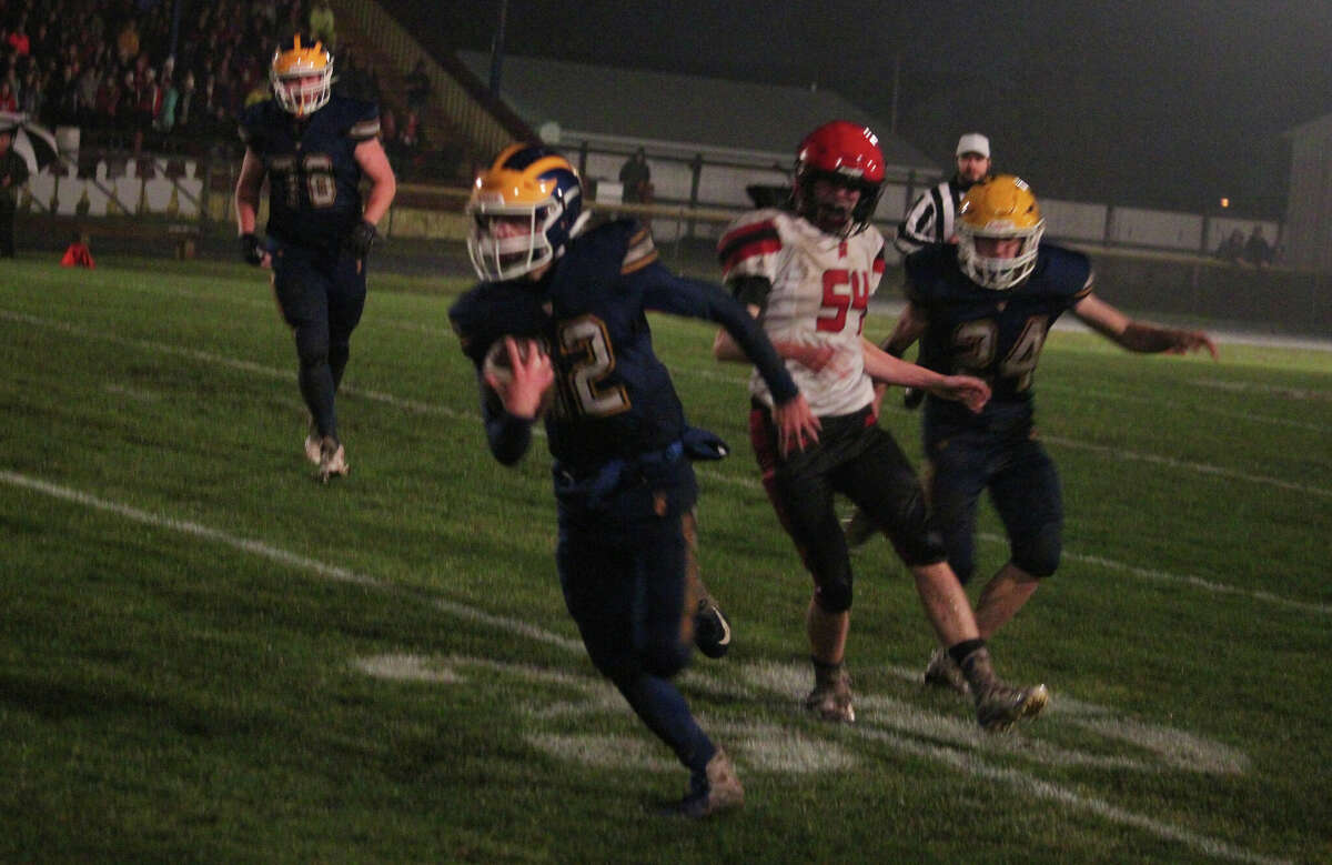 Evart quarterback Preston Wallace has lots of  running room against East Jordan.