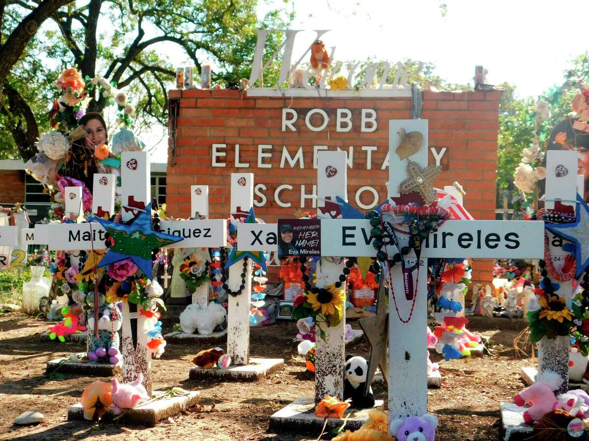 A memorial for the 19 children and two teachers killed in the May shooting sits outside of Robb Elementary on Oct. 24, 2022, in Uvalde. Dr. Mark Escott, medical director for the Texas Department of Public Safety and chief medical officer for the city of Austin, will “lead an analysis of the injuries sustained by the Uvalde shooting victims to determine whether there may have been opportunities to save lives had emergency medical care been provided sooner.”