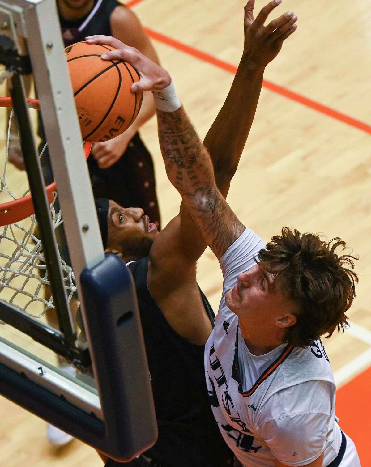 Jacob Germany of UTSA is fouled by Schreiner’s Kamden Ross during college basketball action at the UTSA Convocation Center on Wednesday, Nov. 2, 2022.