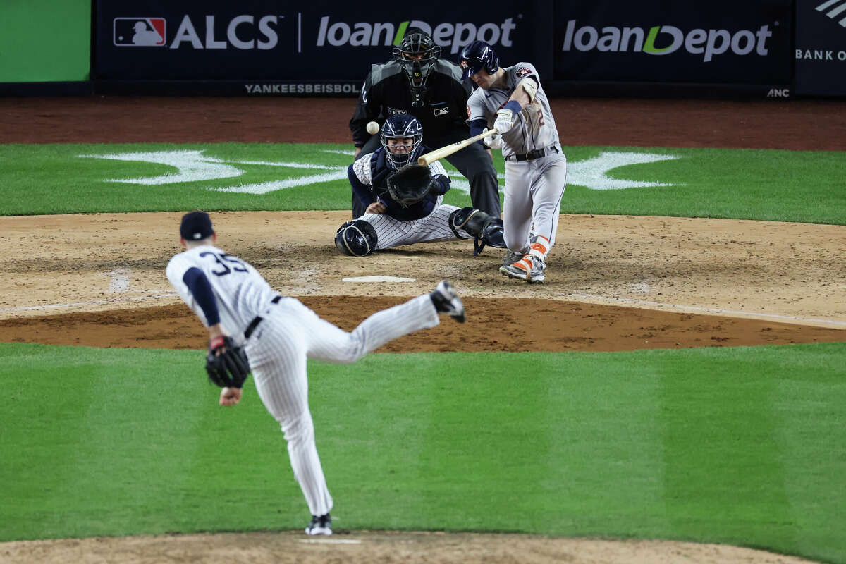 Alex Bregman #2 of the Houston Astros hits an RBI single during the seventh inning against the New York Yankees in game four of the American League Championship Series at Yankee Stadium on October 23, 2022 in the Bronx borough of New York City.