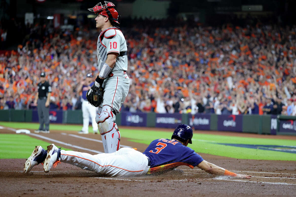 Jeremy Pena #3 of the Houston Astros slides into home in the first inning against the Philadelphia Phillies in Game Two of the 2022 World Series at Minute Maid Park on October 29, 2022 in Houston.