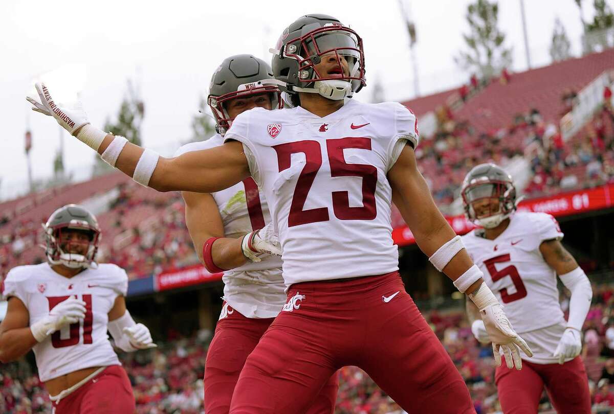 STANFORD, CALIFORNIA - NOVEMBER 05: Jaden Hicks #25 of the Washington State Cougars celebrates after he returned a fumble for a touchdown against the Stanford Cardinal during the second quarter of an NCAA football game at Stanford Stadium on November 05, 2022 in Stanford, California. (Photo by Thearon W. Henderson/Getty Images)