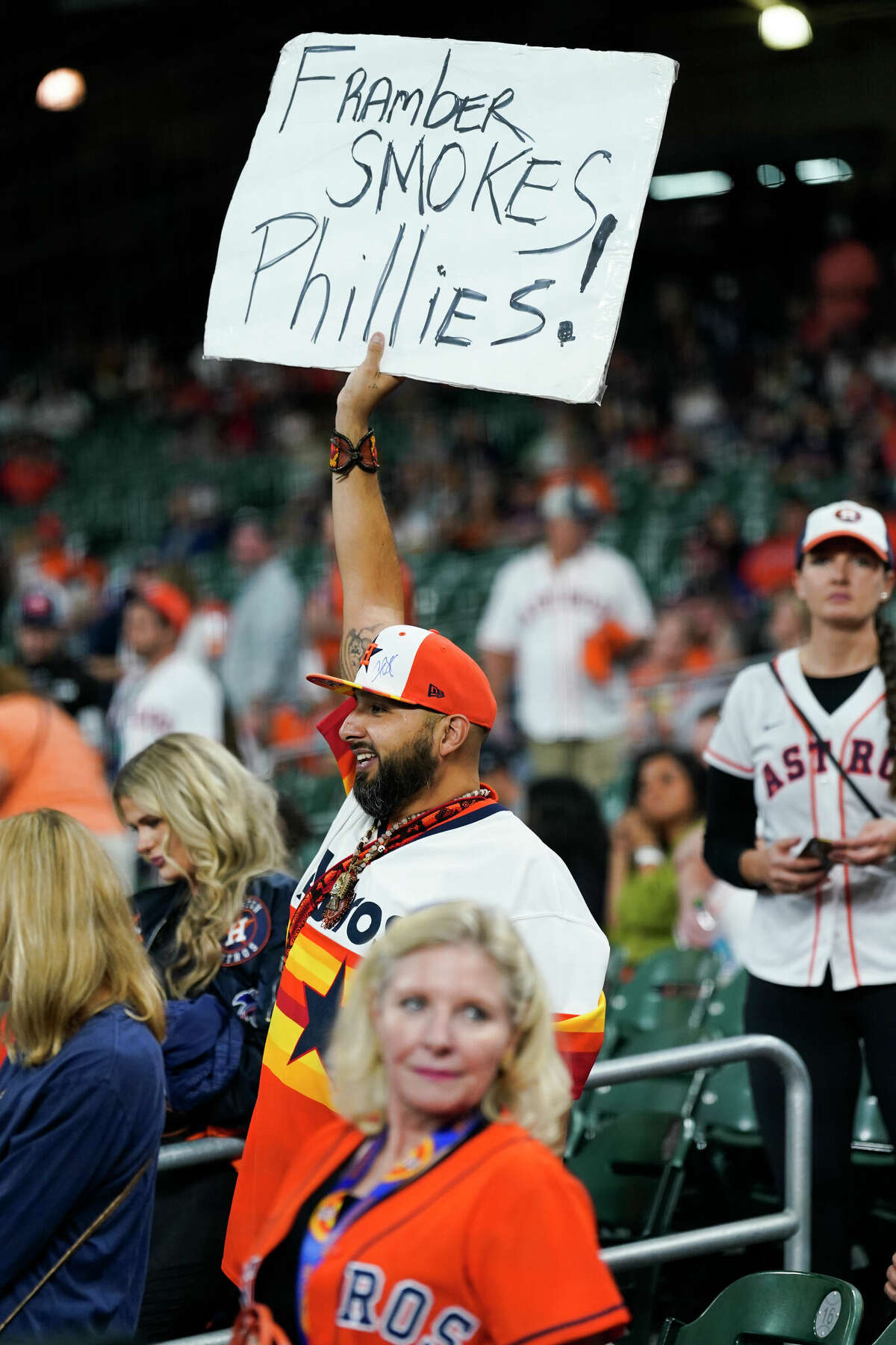 Antonio Gonzales holds up a sign a sign that reads âFrambers smokes Philliesâ before Game 6 of the World Series at Minute Maid Park on Saturday, Nov. 5, 2022, in Houston.