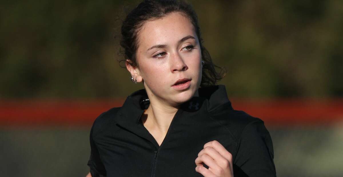 South County cross country runner Madigan Burger works out at the New Berlin track earlier this week.