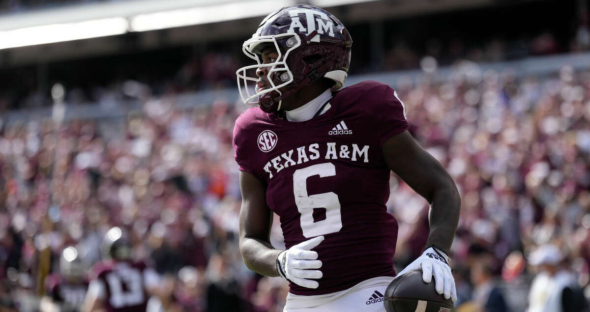 Texas A&M running back Devon Achane (6) reacts after scoring a touchdown against Florida during the first quarter of an NCAA college football game Saturday, Nov. 5, 2022, in College Station, Texas. (AP Photo/Sam Craft)